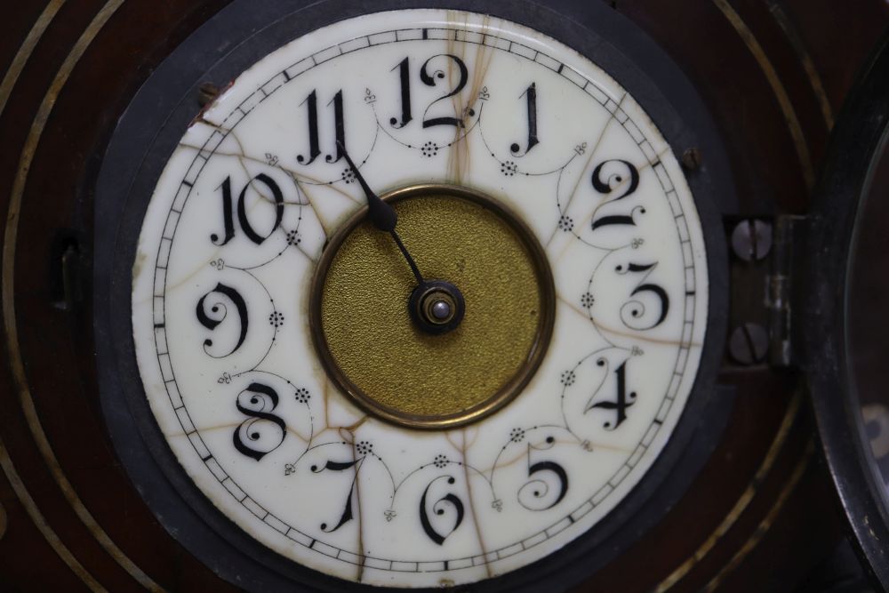 A Regency style mahogany mantel timepiece, with brass and mother of pearl inlay, height 34cm